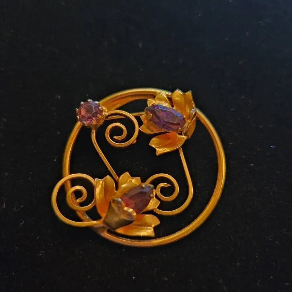 Vintage Gold Tone Floral Circle Brooch Featuring 3 purple rhinestones